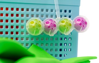 toilet-cleaning-detergent-balls-and-plastic-basket-2021-10-20-18-33-01-utc